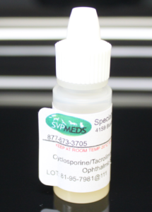 Cyclosporine Tacrolimus eye drops for pets in a small bottle with a clear label