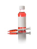 Compounded veterinary metronidazole liquid in a bottle with dosing syringes for pet treatment